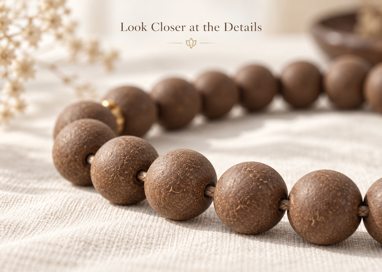 Close-up of brown incense beads showing textured surfaces, drill holes, and connecting cord